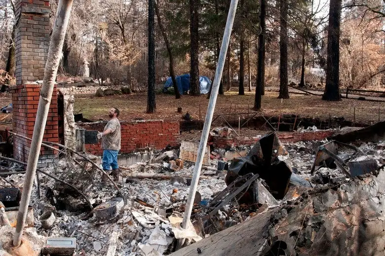 A Paradise resident surveys his home destroyed by the Camp Fire in Butte County.