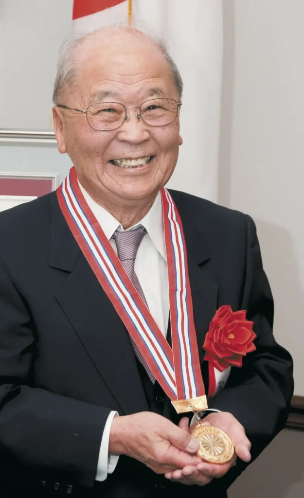 Animal sciences emeritus professor John Matsushima shows off the gold plated medallion he received in being awarded the Japan Emperor award. Masushima is the first Japanese-American to win the Emperor award and was one of four recipient of the award on March 8