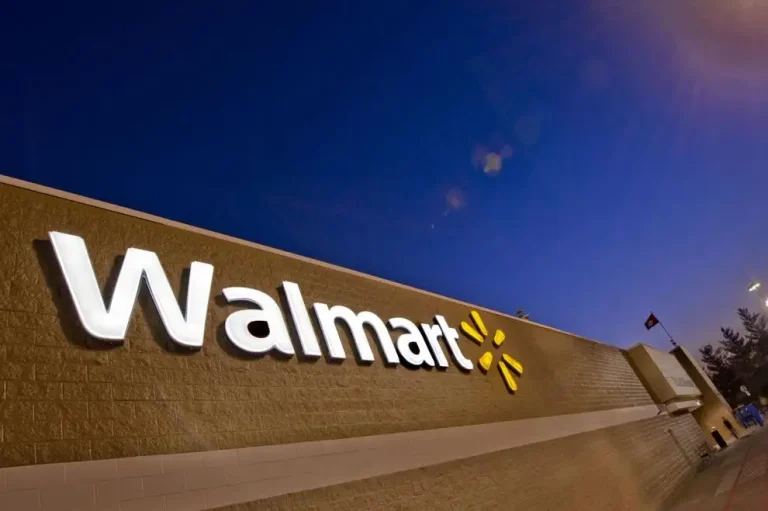 logo - walmart - storefront at night