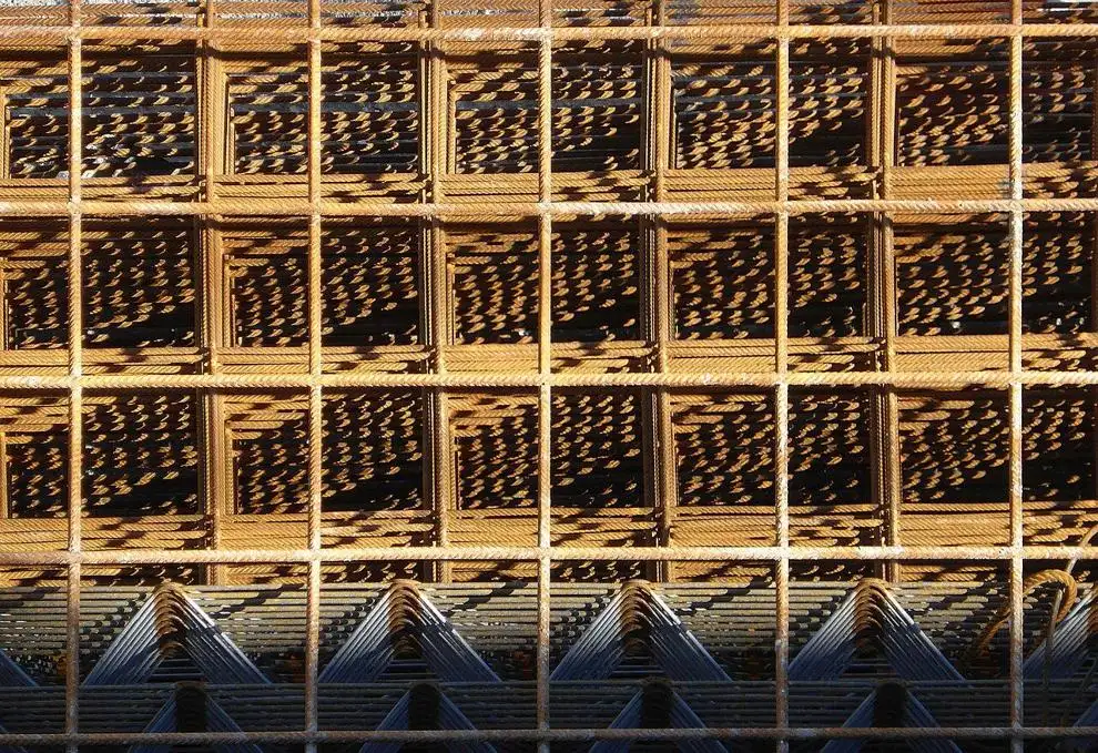 Steel rod grids carefully stacked.